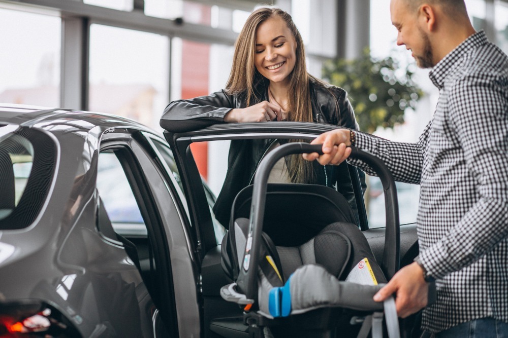 Young Family Buying Car